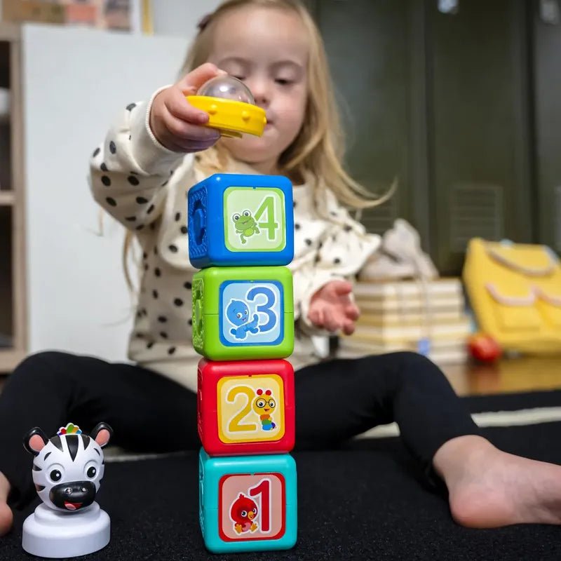Magnetic activity blocks with colorful cubes stacked, showing numbers 1–4 and animal icons