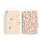 Cotbed fitted sheets pack of 2, pale and blush floral prints, flat lay view