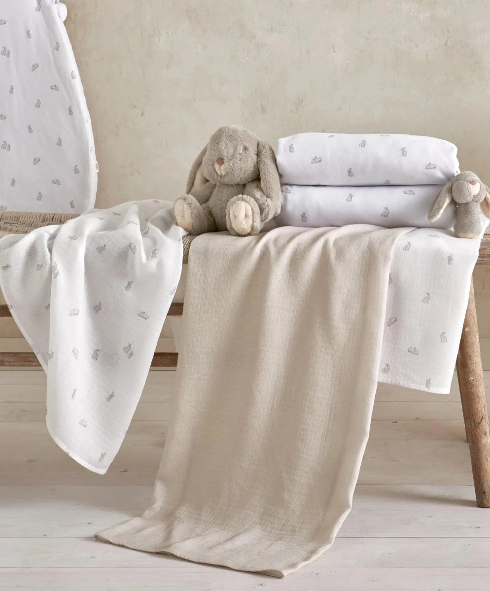 Cotbed fitted sheets set of 2 in white, small bunny pattern, on cot mattress