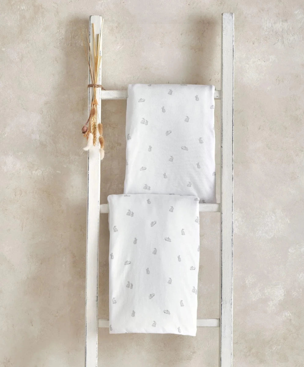 Cotbed fitted sheets set of 2, white with small bunny pattern, stacked view