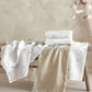 Cotbed fitted sheets (2-pack) in white with small space prints, folded on cot