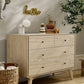 Nursery dresser changer with natural wood drawers and olive green cabinet top