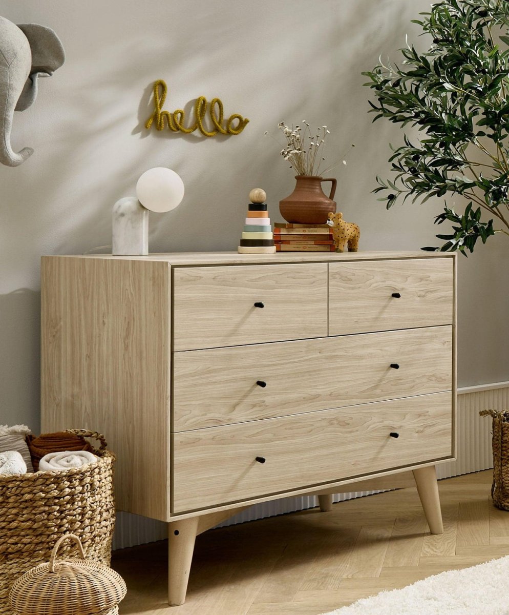 Nursery dresser changer with natural wood drawers and olive green cabinet top