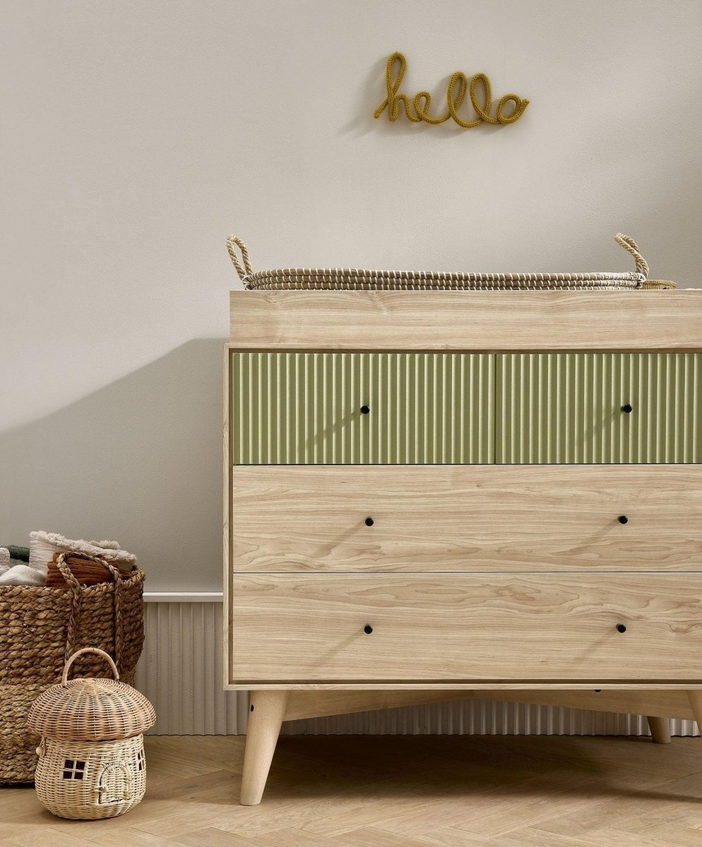 Nursery dresser changer with olive green front drawers and natural wood base