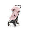 Ultra-compact stroller with pink canopy and seat, rose-gold frame, front-left view