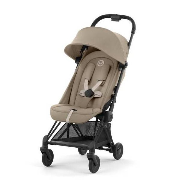 Beige compact stroller with canopy and black frame, side view