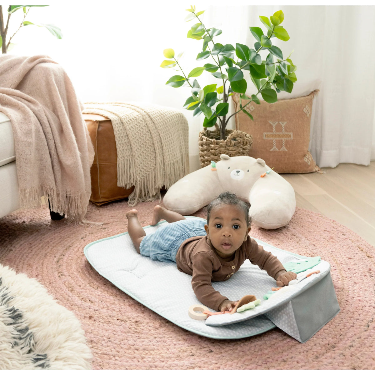 4-in-1 activity mat with bear bolster and dangling toys, gray play surface