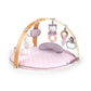 Pink quilted activity duvet mat with arched frame and hanging toy accessories