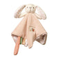 Plush bunny toy with beige dress, speckled paws, and small character patch on chest.