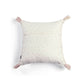 Cream square cushion with tiny floral dots and pink tassels at corners