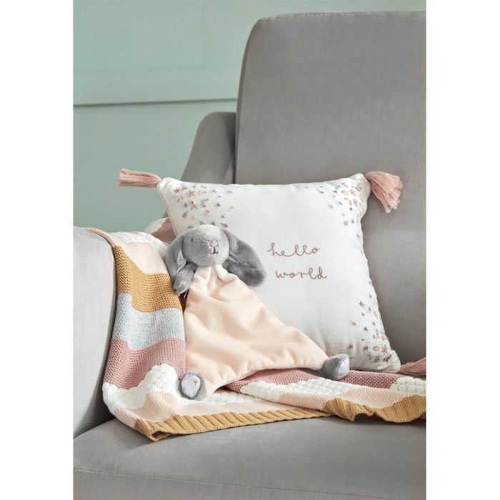 Square cushion with 'hello world' embroidery, pastel floral print, pink tassel trim