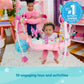 Pink Minnie Mouse baby activity jumper with hanging toy arches and seat