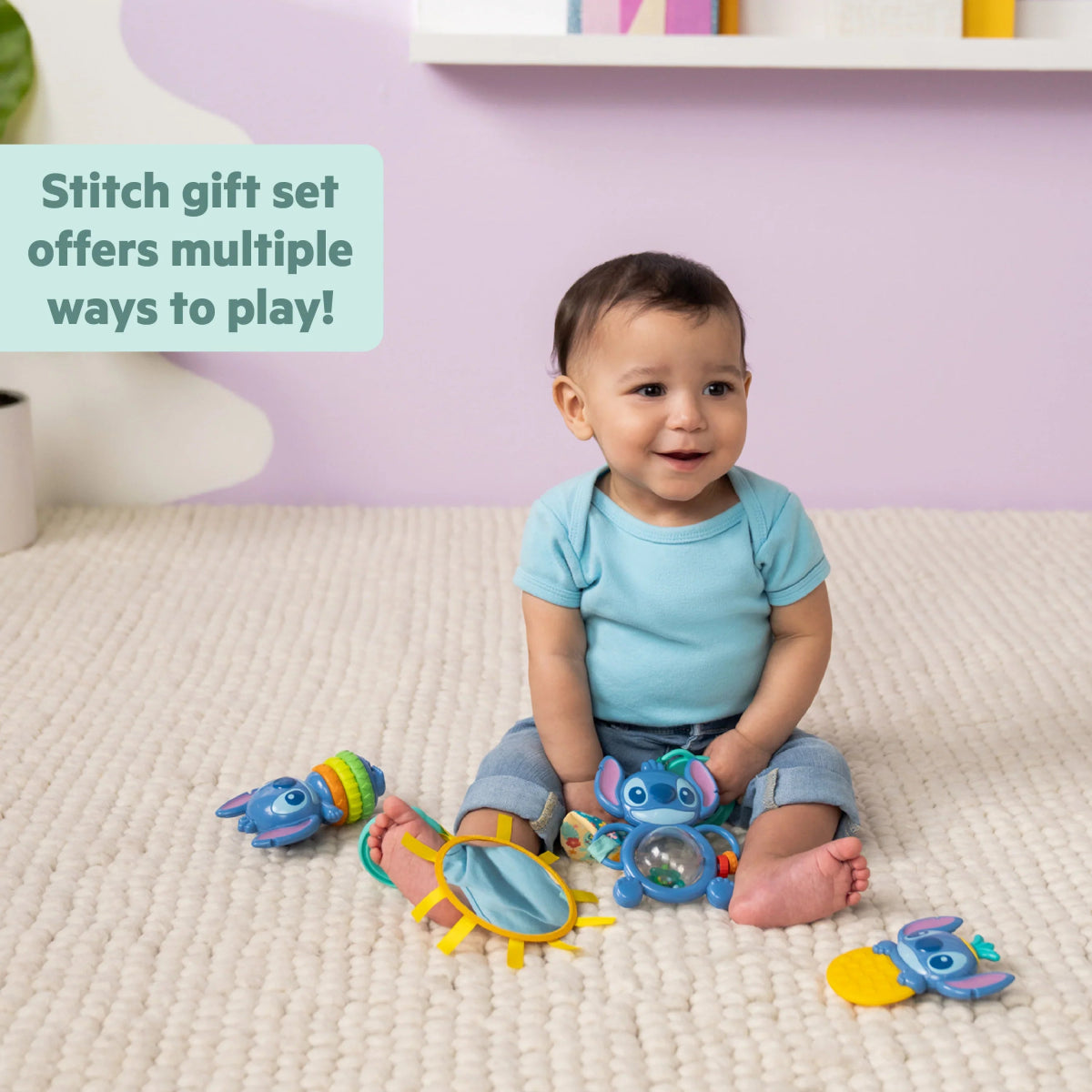Stitch baby activity toy set with teether and rattle, shown during play