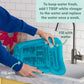 Inflatable water play mat with blue inner panel, being filled with water
