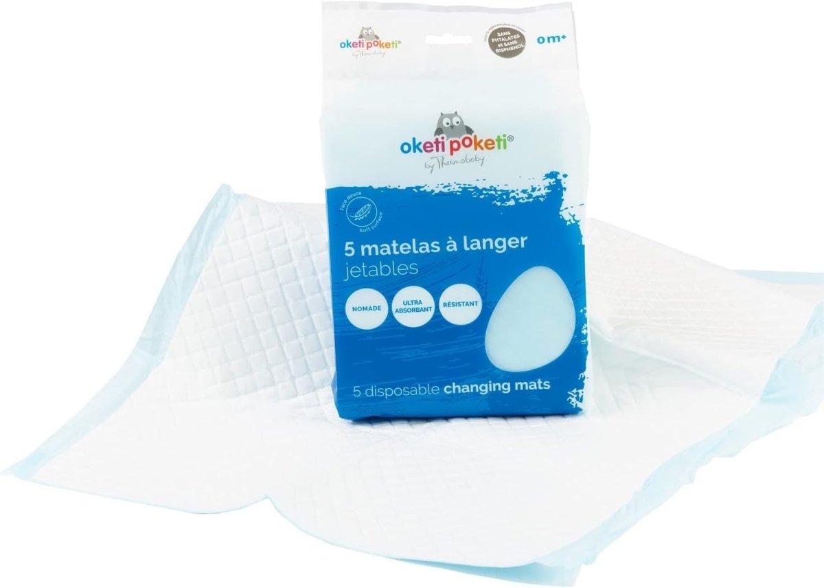 Disposable changing mat sheet with light-blue grid texture beside 5-count pouch