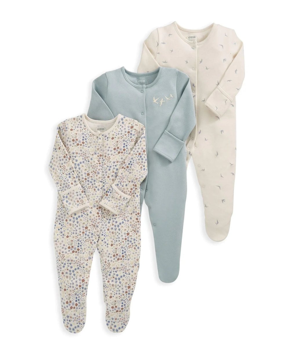 Three floral sleepsuits, long-sleeve button-front footed legs in blue, cream, and white