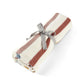 Knitted striped blanket, cream with rust and gray bow tie detail