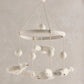 Plush baby musical mobile with white duck figures and hanging pom-pom balls