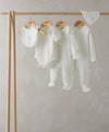 Duckling outfit set: bib, bodysuit, pants and footed romper, all in off-white