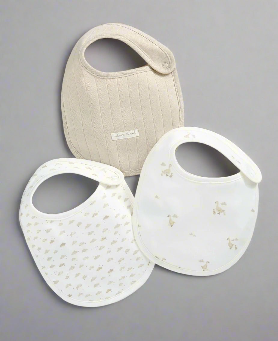 Duckling bib set of 3: cream and white fabric bibs with duck prints