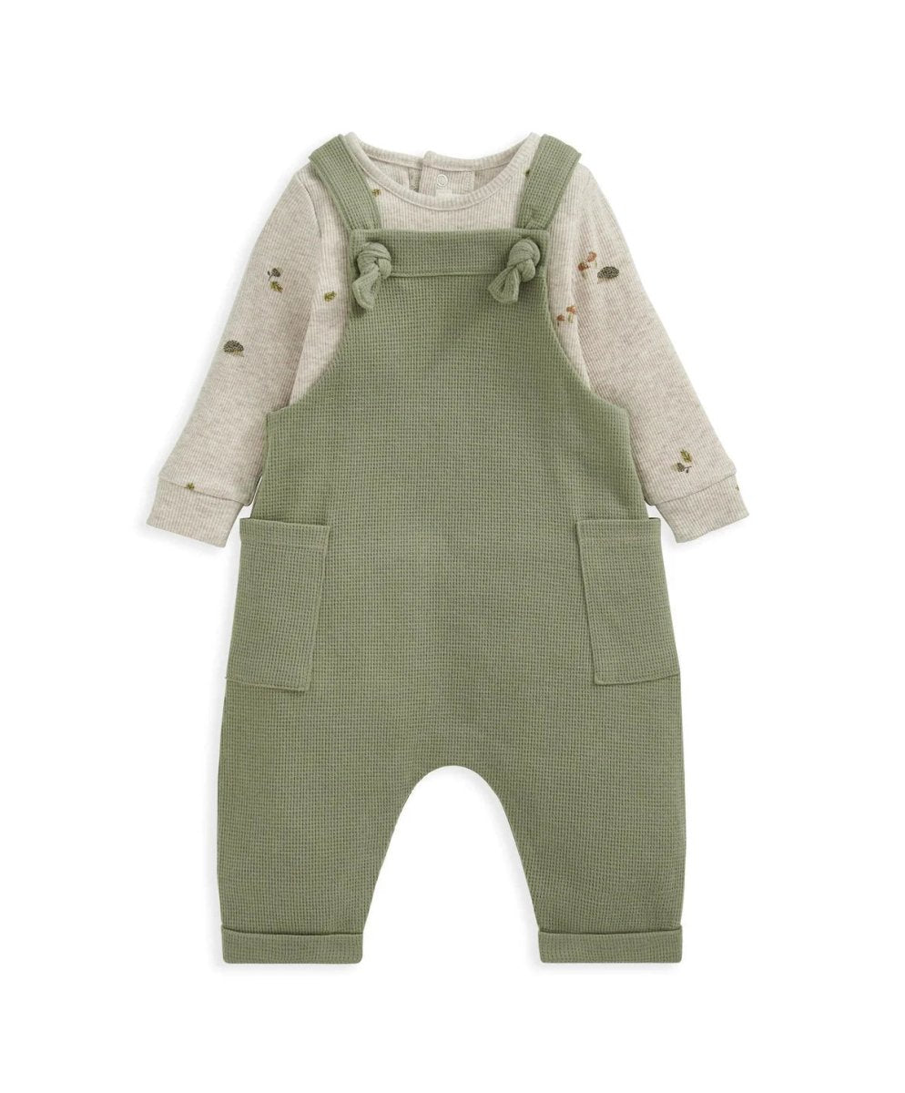 Green dungarees over speckled long-sleeve bodysuit, square pockets and cuffed legs