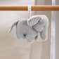 Elephant plush chime toy hanging from wooden bar, gray fabric with small trunk