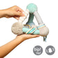 Plush activity pyramid toy with mint legs, striped fabric, and dangling rings in hand