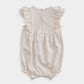 Shortie romper back with ruffled shoulders and button-front placket, pale pink