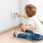 Outlet safety cover with rotating shutter, white, installed on wall