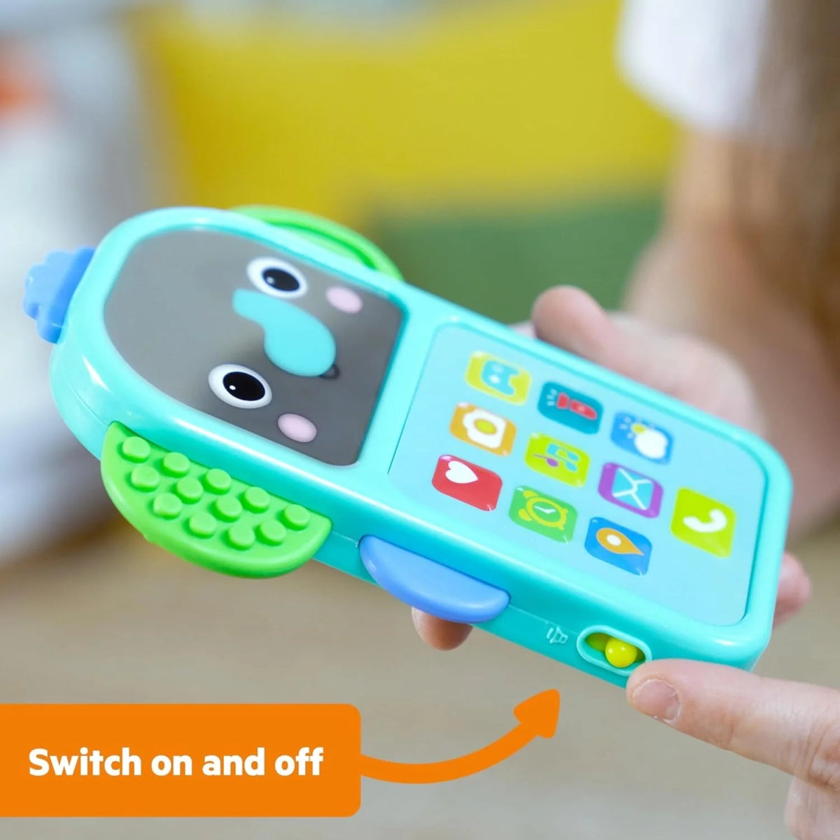 Elephant baby phone toy in teal with blue keypad and smiling elephant face, green buttons