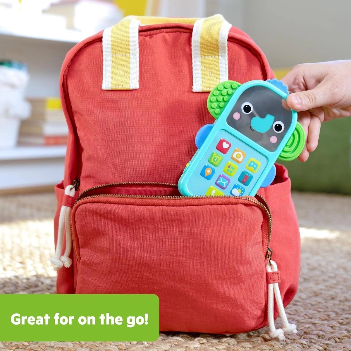 Elephant-shaped baby phone toy in teal with colorful icon buttons and green side grips