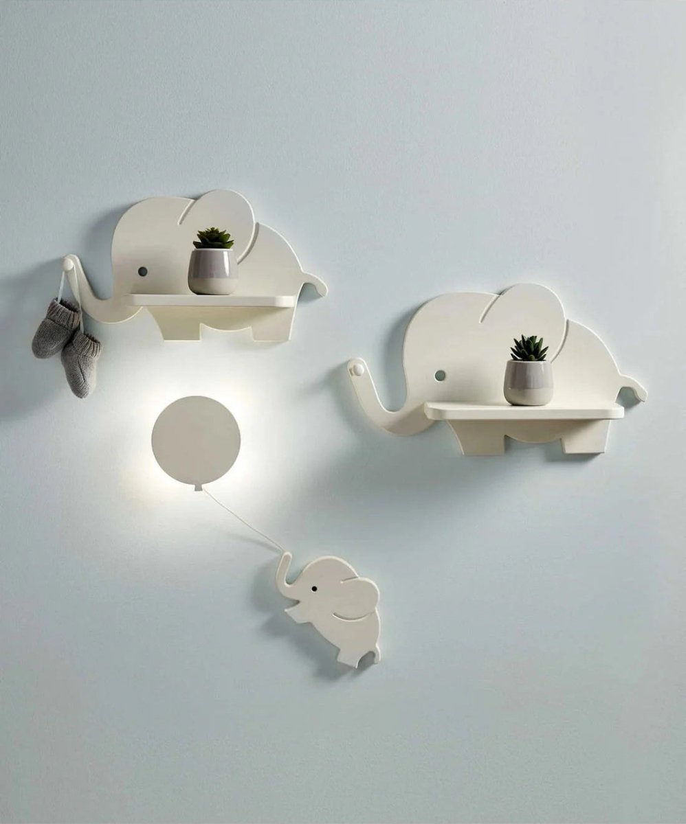 Pair of white elephant wall shelves with plants and elephant nightlight