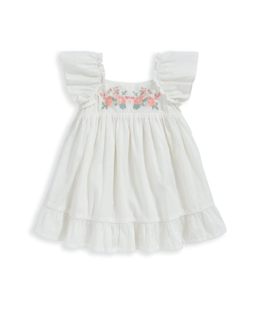 White dress with floral embroidered bodice, gathered waist, and puff sleeves