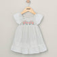 White embroidered flower dress with puff sleeves and tiered skirt