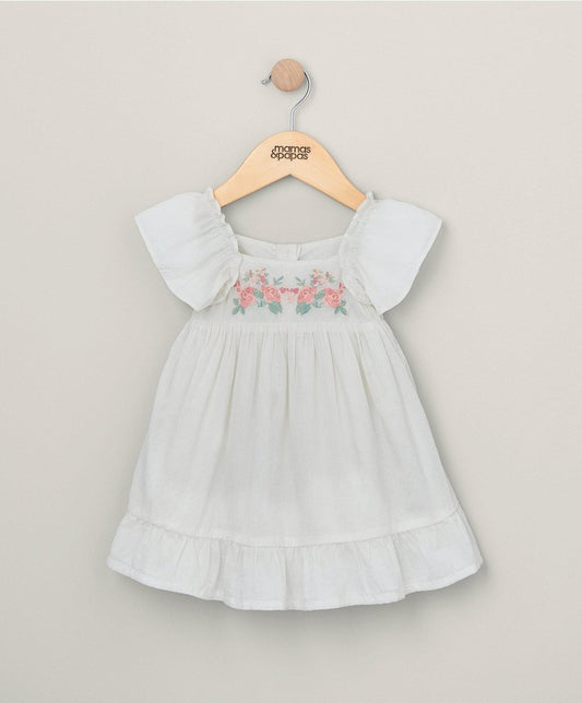 White embroidered flower dress with puff sleeves and tiered skirt