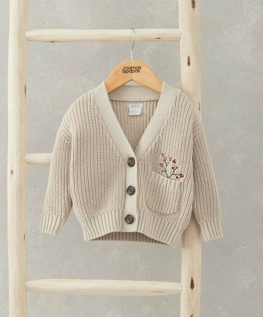 Beige knit cardigan with V-neck, button front, and embroidered chest pocket
