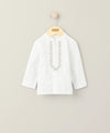 White embroidered shirt with vertical front placket and decorative trim, 3/4 sleeves