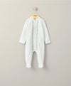 White embroidered sleepsuit with long sleeves and front opening, full-length legs.