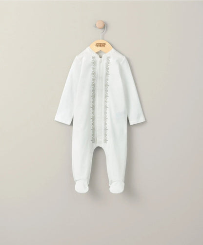 White embroidered sleepsuit with long sleeves and front opening, full-length legs.