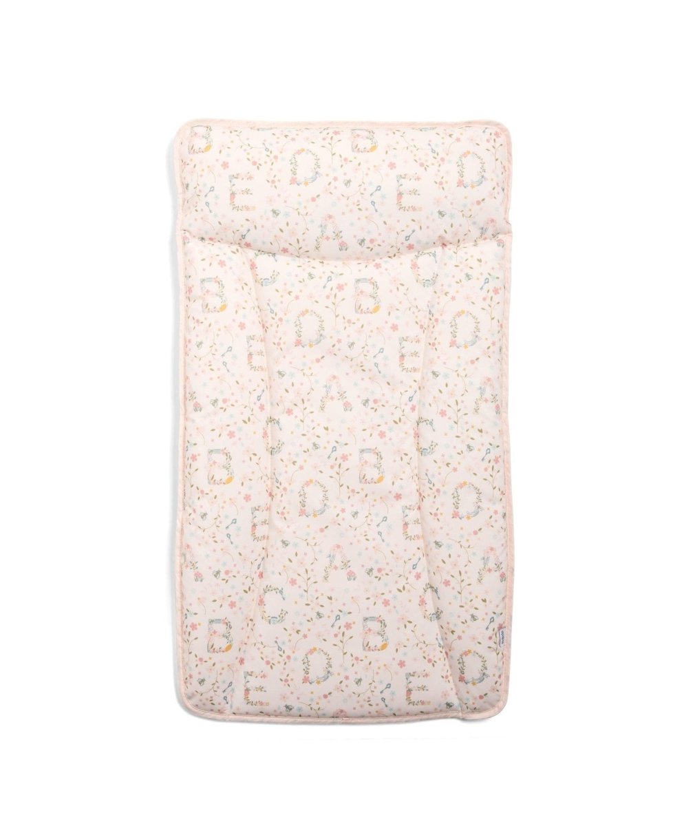 Changing mat mattress in light pink with repeating letter pattern, padded top.