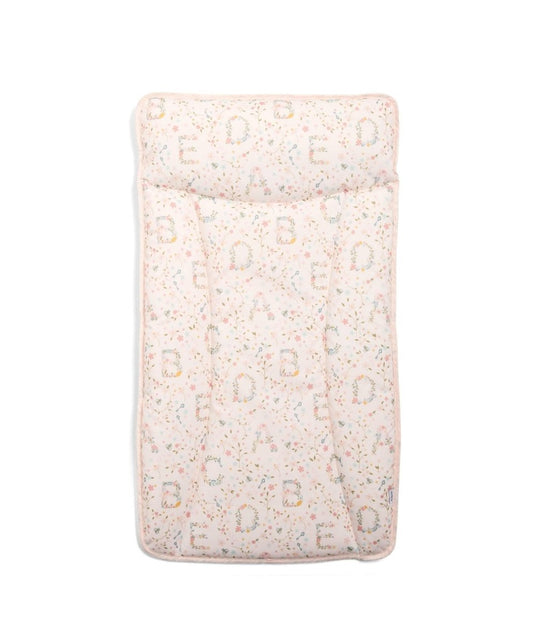 Changing mat mattress in light pink with repeating letter pattern, padded top.