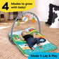 Activity play mat with farm arch and hanging toys, baby lying on patterned surface