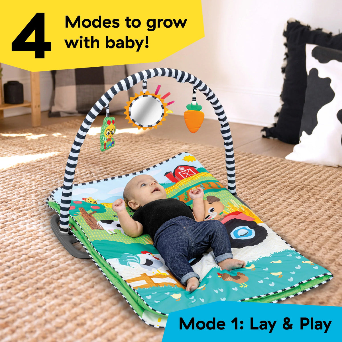 Activity play mat with farm arch and hanging toys, baby lying on patterned surface