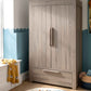 Grey wash 2-door nursery wardrobe with drawer and vertical handle, front view.
