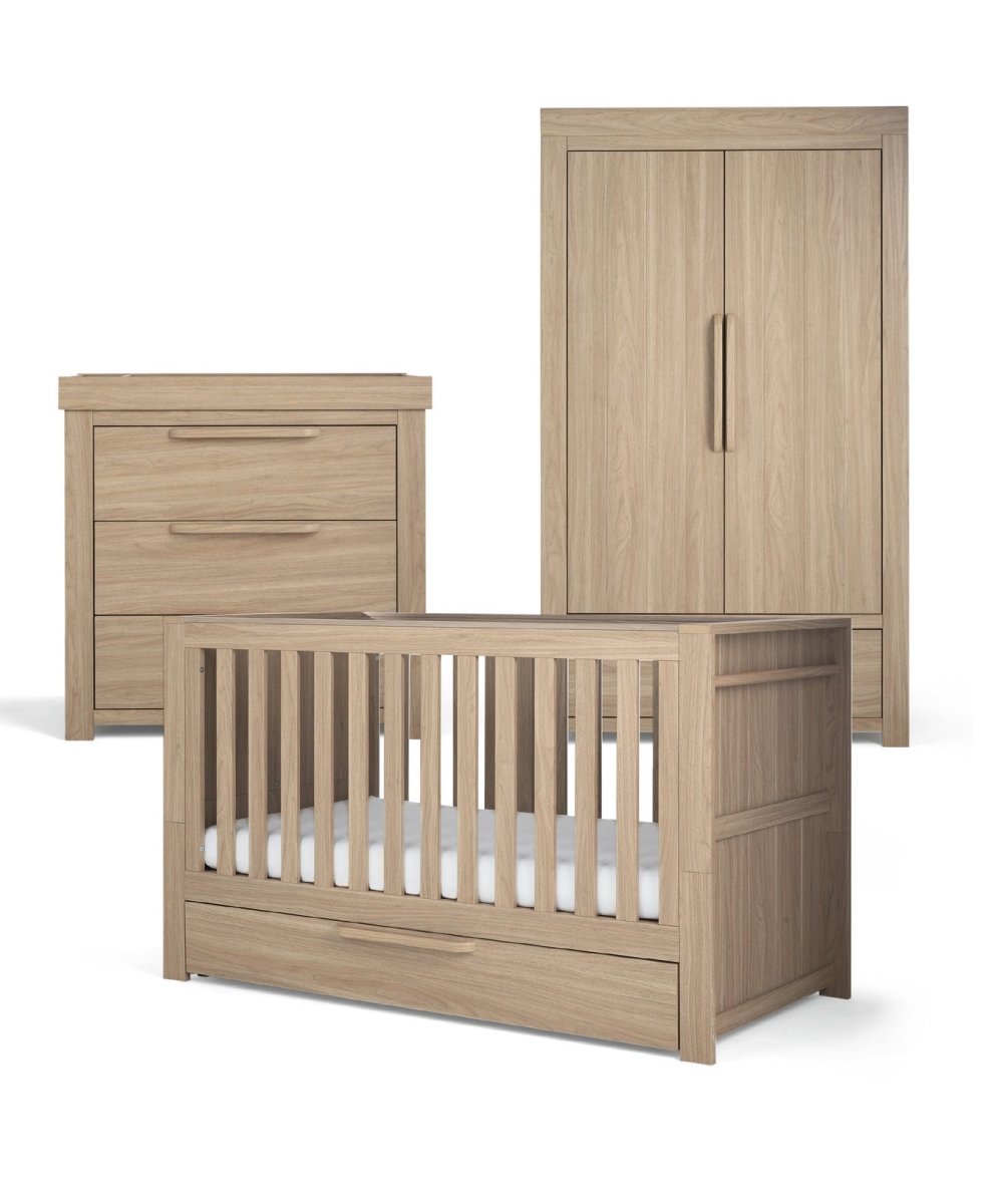 Oak-toned cot bed with slatted ends, matching dresser and double wardrobe