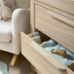Oak dresser changer with open top drawer and light fabric liner