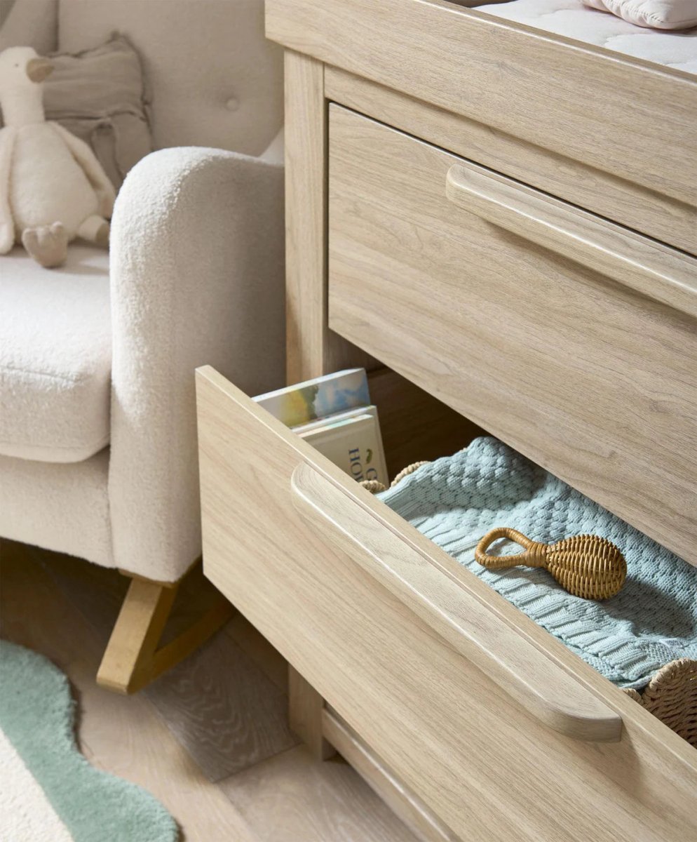 Oak dresser changer with open top drawer and light fabric liner