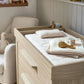 Oak dresser changer with changing pad on top and two drawers front