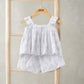 Frill-sleeve top and shorts set with ruffled tiers and lace edging, allover white print