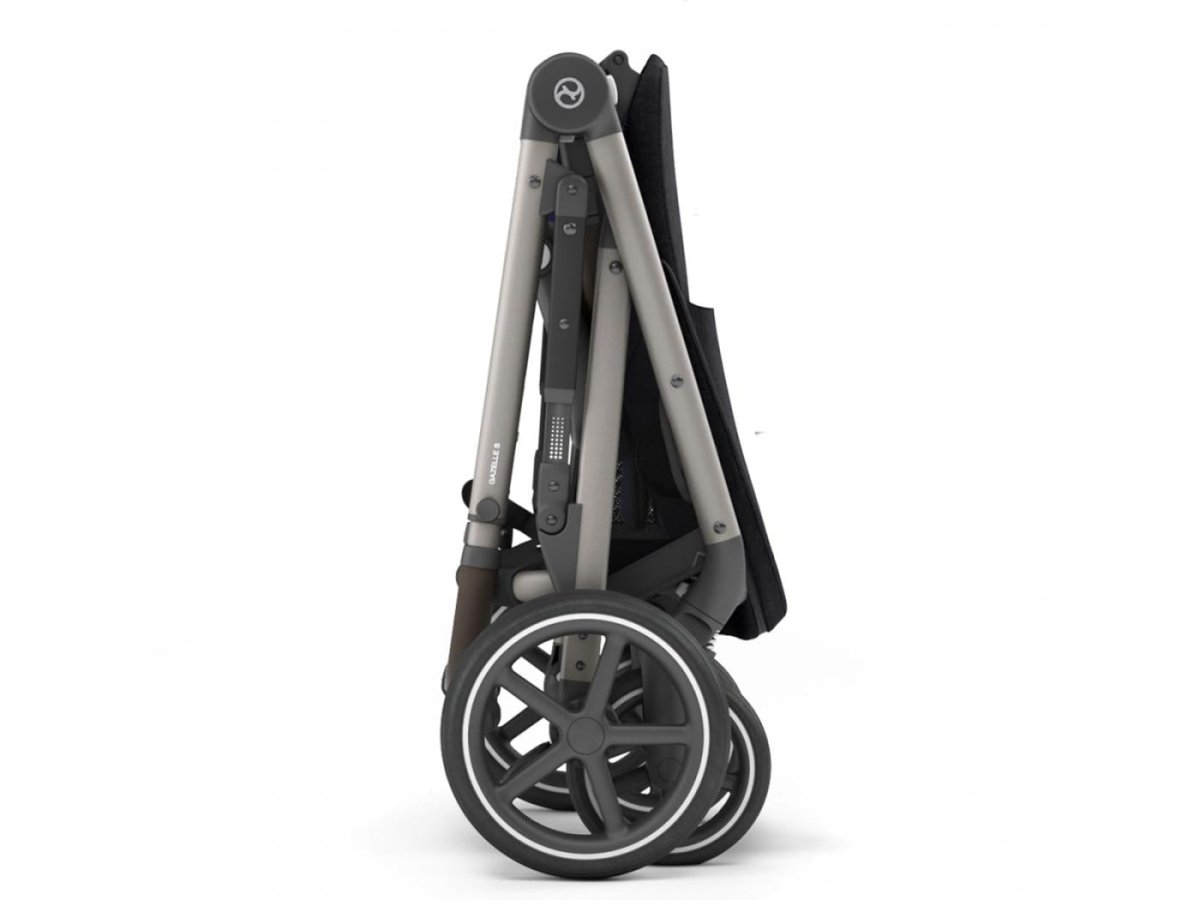 Black and grey stroller frame with large spoked wheels and folded canopy